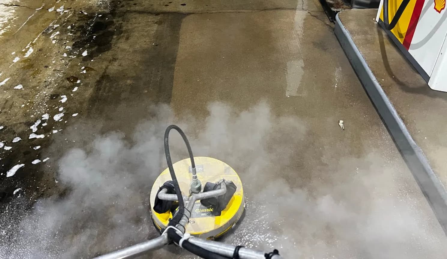 Property Power Wash surface cleaner lifting grime from commercial concrete